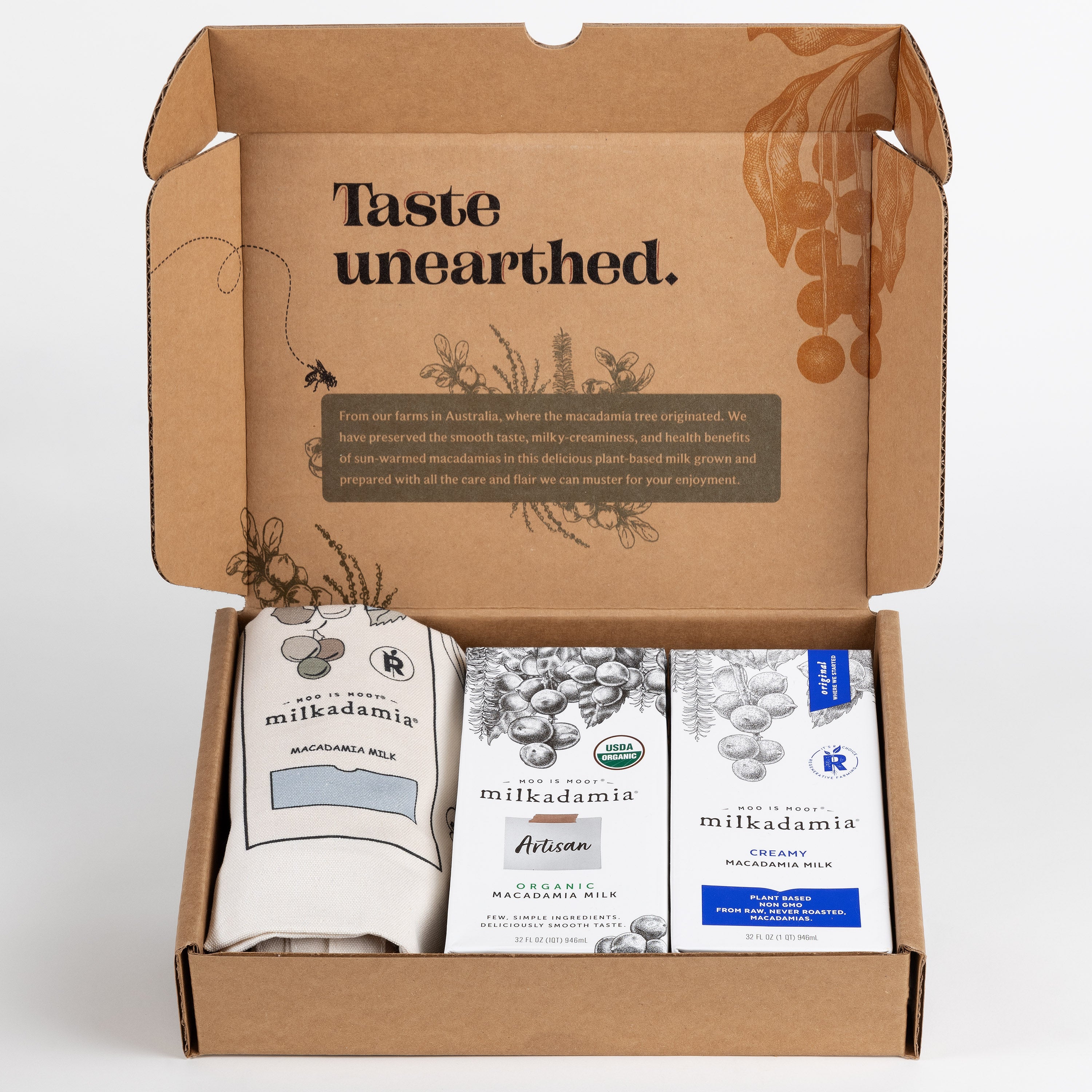 Milkadamia sweet holiday gift box containing two individual 32 oz cartons of Milkadamia Creamy and Organic Artisan and a signature Milkadamia tote bag